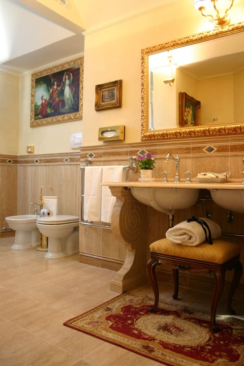 Shower, designer toiletries, hair dryer, bidet