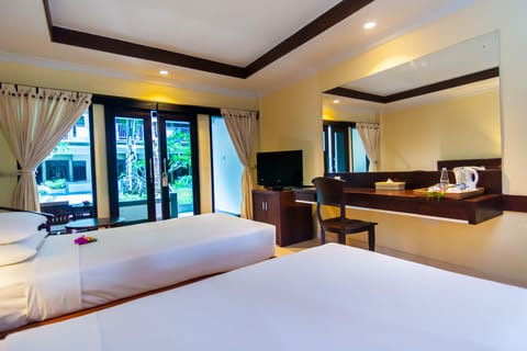 Deluxe Room, Terrace, Poolside | Minibar, in-room safe, desk, iron/ironing board