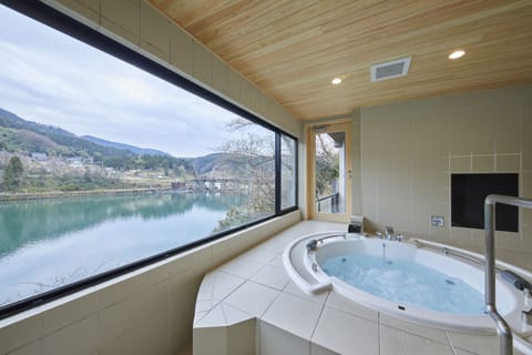 Basic Suite, 2 Bedrooms, Non Smoking, River View (201) | Bathroom | Free toiletries, hair dryer, bathrobes, slippers
