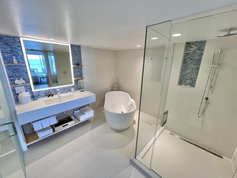 Penthouse Oceanfront Suite | Bathroom | Shower, rainfall showerhead, designer toiletries, hair dryer