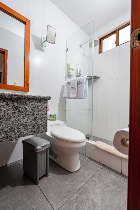 Family Room, 2 Double Beds | Bathroom | Shower, free toiletries, hair dryer, towels