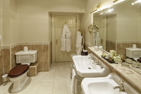 Separate tub and shower, designer toiletries, hair dryer, bathrobes