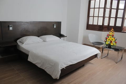 Standard Triple Room | Minibar, desk, iron/ironing board, free WiFi