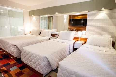 Superior Quadruple Room | Minibar, in-room safe, desk, blackout drapes