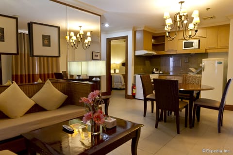 Suite (2-bedroom)  | Living room | 21-inch LCD TV with cable channels, TV