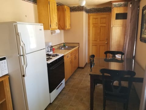 Family Cabin, Multiple Beds, Fireplace | Private kitchen | Fridge, microwave, coffee/tea maker, cleaning supplies