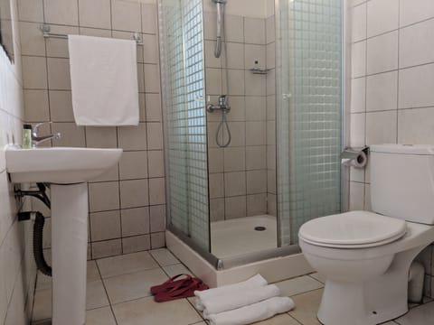 Family Suite, 2 Bedrooms | Bathroom | Shower, free toiletries, slippers, towels