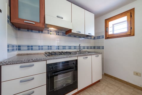 Apartment, 2 Bedrooms (TRILO CARAIBI) | Private kitchenette | Full-size fridge, stovetop, cookware/dishes/utensils