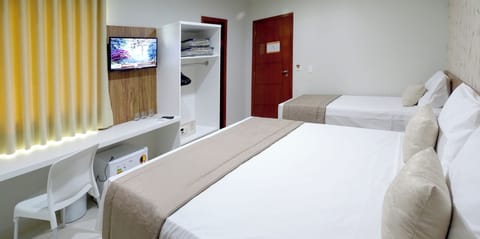 Luxury Triple Room | Minibar, desk, blackout drapes, free WiFi