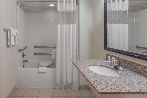 Shower, designer toiletries, hair dryer, towels