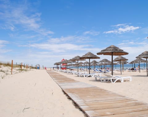 Beach nearby, white sand, beach volleyball