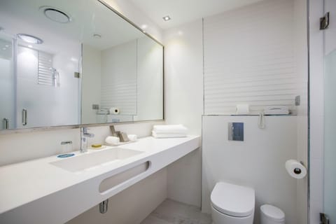 Separate tub and shower, designer toiletries, hair dryer, bathrobes
