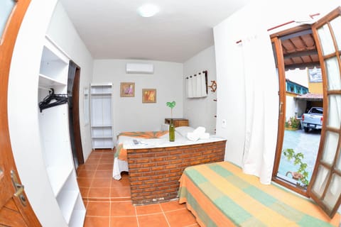 Triple Room | Minibar, blackout drapes, iron/ironing board, free WiFi