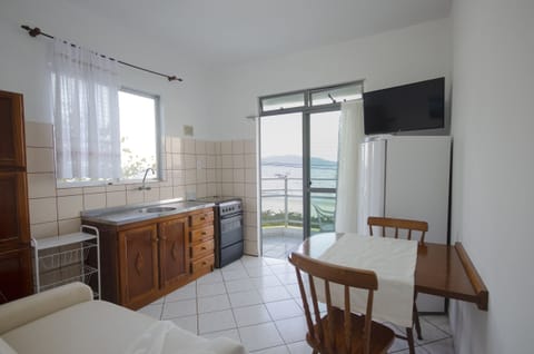 Standard Apartment, 1 Bedroom, Sea View | Private kitchen | Fridge, microwave, oven, stovetop