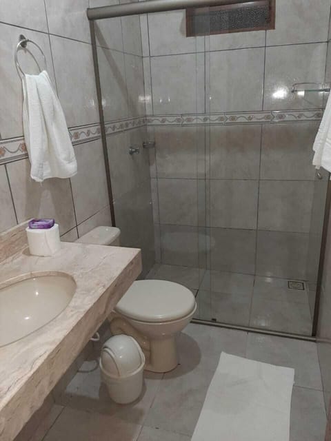 Economy Room | Bathroom | Shower, free toiletries, hair dryer, towels