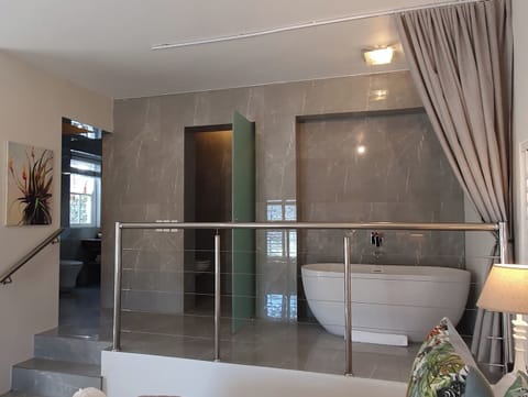 Premier Suite | Bathroom | Designer toiletries, hair dryer, bathrobes, towels