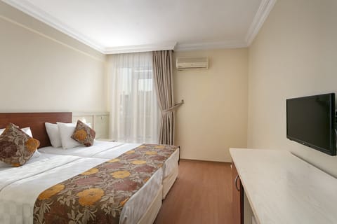 Standard Triple Room | Premium bedding, minibar, iron/ironing board, free rollaway beds