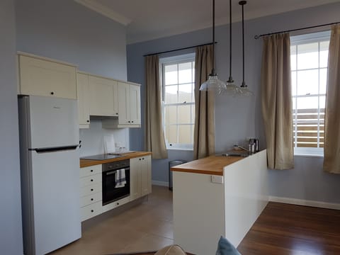 Apartment, 1 Bedroom, Garden Area (Minimum Age 18) | Private kitchen | Full-size fridge, microwave, oven, stovetop