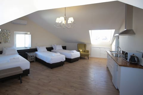 Quadruple Room, Kitchenette | Premium bedding, in-room safe, soundproofing, free WiFi