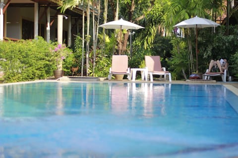 Outdoor pool, open 7:00 AM to 8:00 PM, pool umbrellas, sun loungers