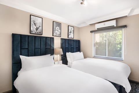 Suite, 2 Bedrooms, Non Smoking | In-room safe, desk, blackout drapes, iron/ironing board