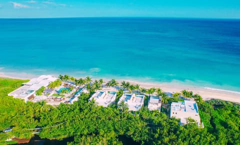 On the beach, white sand, sun loungers, beach umbrellas