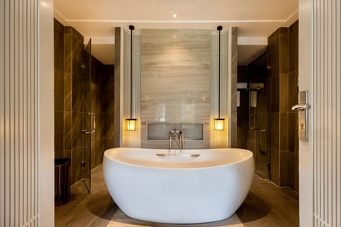 Separate tub and shower, deep soaking tub, designer toiletries