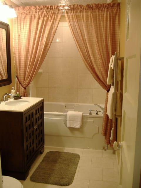 Superior Suite, 1 King Bed, Private Bathroom (Floral Bouquet Suite - 2nd Floor) | Bathroom | Combined shower/tub, designer toiletries, hair dryer, towels