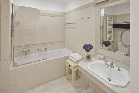 Combined shower/tub, designer toiletries, hair dryer, bathrobes