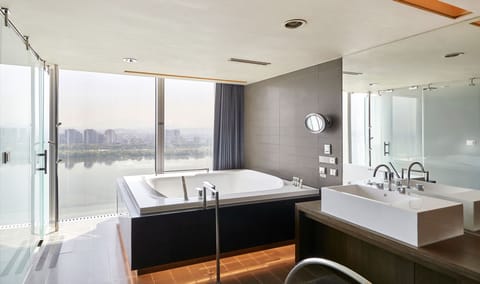 Spa Deluxe Double Room, River View | Bathroom | Separate tub and shower, rainfall showerhead, free toiletries