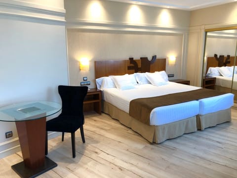 Standard Room | 4 bedrooms, pillowtop beds, minibar, in-room safe