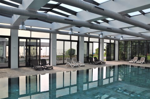 Indoor pool, open 9:00 AM to 6:00 PM, pool umbrellas, sun loungers