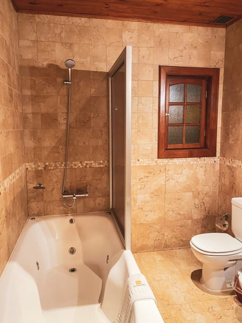 Superior Room, Lake View | Bathroom | Combined shower/tub, deep soaking tub, rainfall showerhead