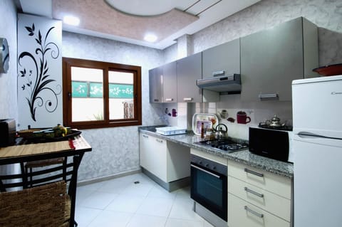 Luxury Apartment, 2 Bedrooms | Private kitchen | Full-size fridge, microwave, stovetop, coffee/tea maker