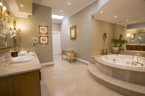 Presidential Suite, 1 King Bed | Bathroom | Separate tub and shower, jetted tub, rainfall showerhead