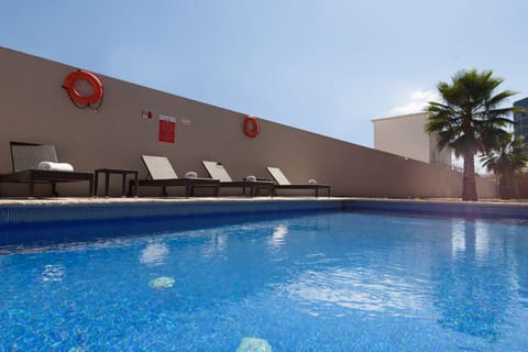 Outdoor pool, open 9:00 AM to 8:00 PM, pool umbrellas, sun loungers