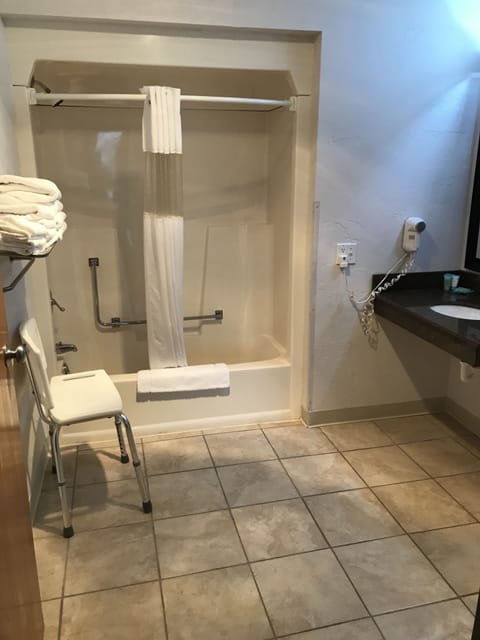 Room, 1 Queen Bed, Accessible (One Queen Handicap Accessible) | Bathroom | Combined shower/tub, free toiletries, hair dryer, towels
