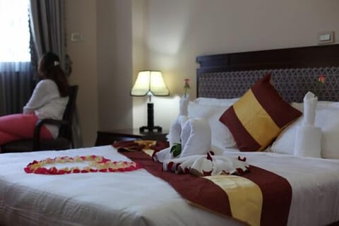 Deluxe Double or Twin Room, City View | Minibar, in-room safe, desk, iron/ironing board