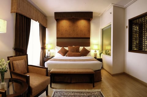 Superior Suite, 1 Bedroom | Minibar, in-room safe, iron/ironing board, free WiFi