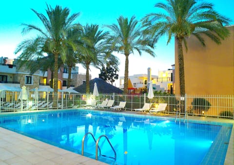 Outdoor pool, open 9:00 AM to 8:00 PM, pool umbrellas, sun loungers