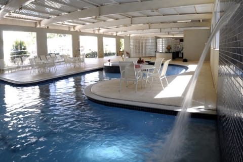 Indoor pool, outdoor pool, pool umbrellas, sun loungers