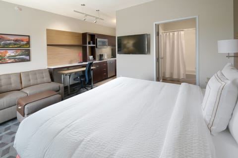 Premium bedding, pillowtop beds, laptop workspace, blackout drapes