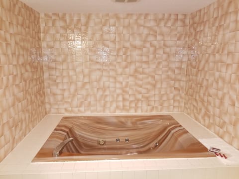 Suite, 1 King Bed, Non Smoking, Jetted Tub | Deep soaking bathtub