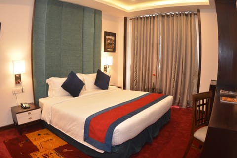 Deluxe Double or Twin Room, 1 Double or 2 Twin Beds, City View | 1 bedroom, premium bedding, minibar, in-room safe