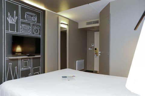 Desk, laptop workspace, blackout drapes, iron/ironing board