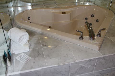 Executive Suite, Jetted Tub | Bathroom | Hair dryer, towels