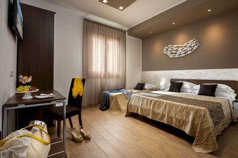 Triple Room | Minibar, in-room safe, desk, iron/ironing board