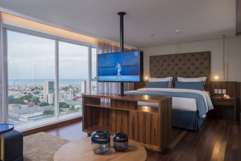 Executive Suite | Minibar, in-room safe, individually decorated, individually furnished