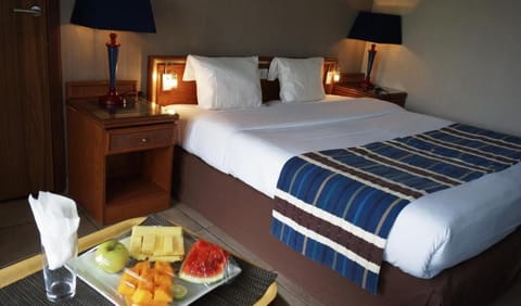 Suite, Pool View | Premium bedding, minibar, in-room safe, desk