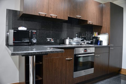 Family Apartment | Private kitchen | Fridge, microwave, oven, stovetop